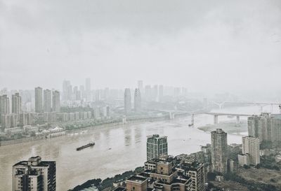 High angle view of buildings in city against sky