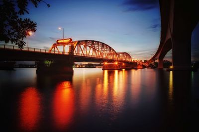 View of bridge over river during sunset