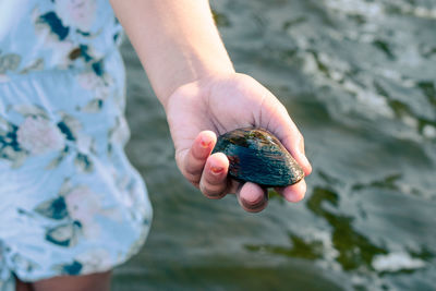 Close-up of hand holding water