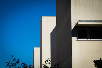 Low angle view of building against blue sky