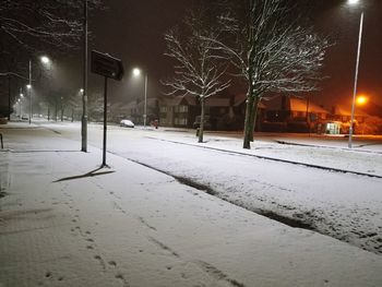 Snow covered street at night