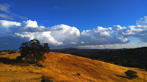 View of landscape against cloudy sky
