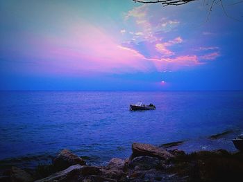 Scenic view of calm sea at sunset