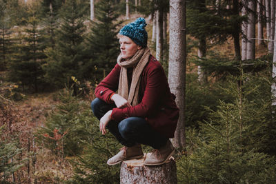 Full length of woman sitting in park