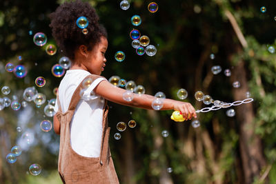 High angle view of girl with bubbles