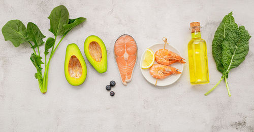 High angle view of fruits on table against white background