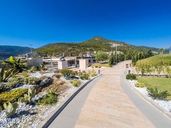 Scenic view of mountains against clear blue sky