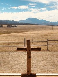 Fence on field against sky