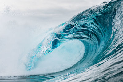 Water splashing in sea against sky