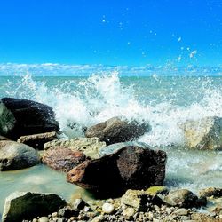 Sea waves splashing on rocks