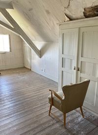 Empty chairs on floor against wall at home