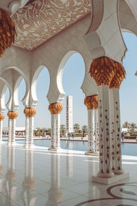 View of mosque and buildings against sky