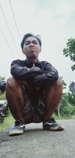 Portrait of young man sitting on looking away