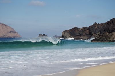 Scenic view of beach against sky