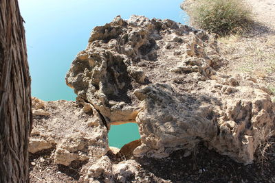 Low angle view of rock formation against clear sky