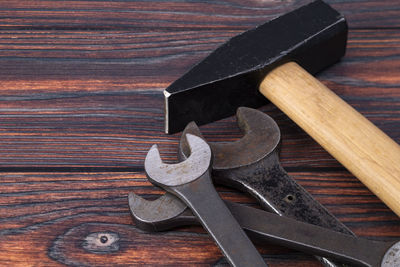 High angle view of work tools on wooden table