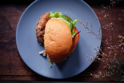 Directly above shot of burger in plate on table