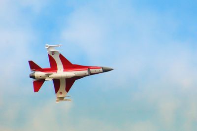 Low angle view of airplane flying in sky