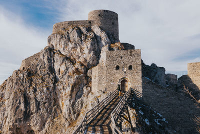 Low angle view of old ruins against sky