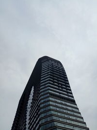 Low angle view of skyscraper against sky