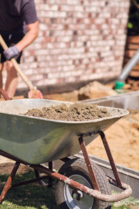 Midsection of man working on table