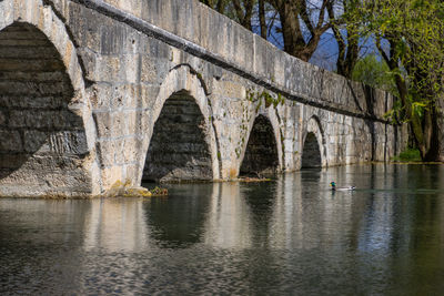 Arch bridge over river