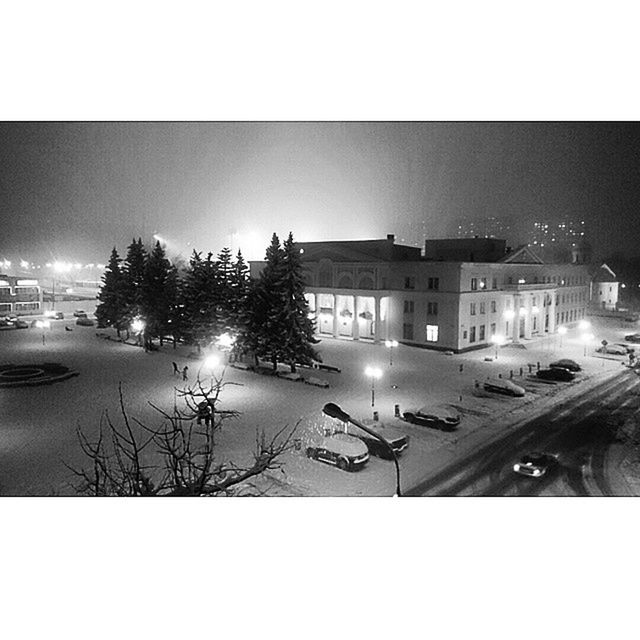 building exterior, transfer print, architecture, built structure, illuminated, night, auto post production filter, street light, car, street, city, clear sky, transportation, land vehicle, snow, winter, house, residential structure, tree, sky