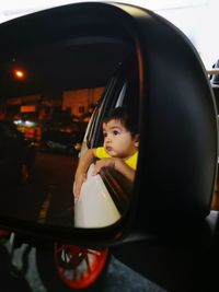 Portrait of woman sitting in car