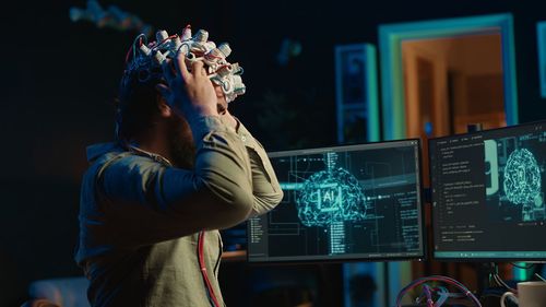 Side view of man using mobile phone