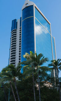 Low angle view of skyscrapers against clear sky