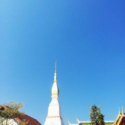 High section of built structure against clear blue sky