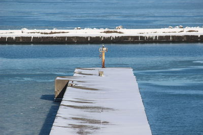 Lighthouse in winter sea