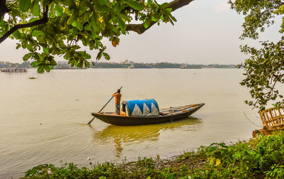 Man rowing boat in lake