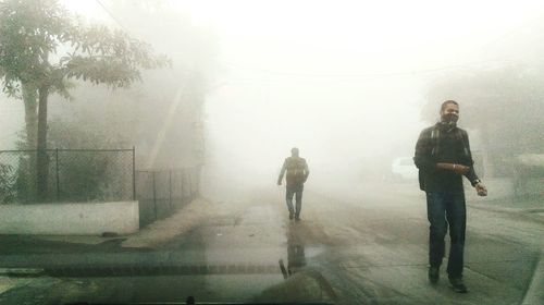 Woman standing on railing