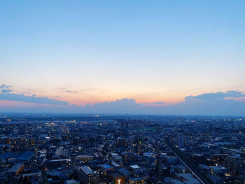 High angle view of city against sky during sunset