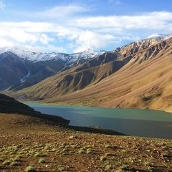 Scenic view of lake against cloudy sky