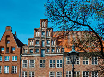 Low angle view of building against blue sky