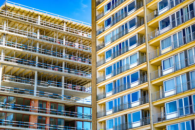 Low angle view of modern building in city against sky