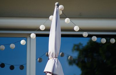 Low angle view of umbrella in the city