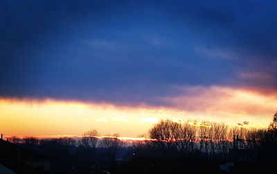 Silhouette landscape against sky during winter