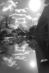 Scenic view of lake against sky during winter