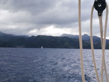 Sailboat in sea against sky