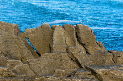 Close-up of rocks by sea