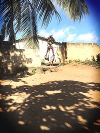 Bicycles on beach against sky