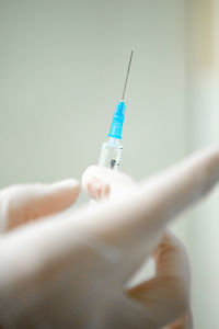 Infusion syringe in the hands of a nurse. selective focus