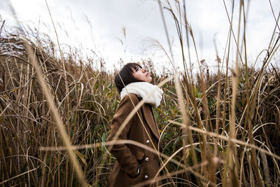 Woman standing on grass