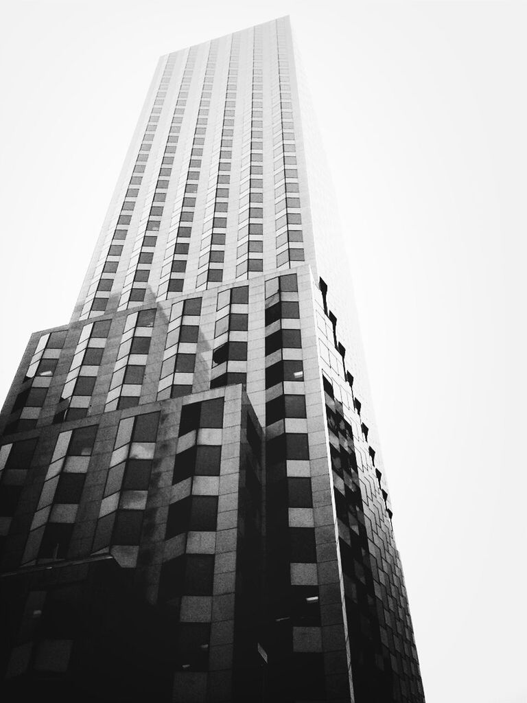 architecture, low angle view, built structure, building exterior, office building, modern, tall - high, clear sky, skyscraper, building, city, tower, window, sky, tall, glass - material, day, outdoors, no people, copy space