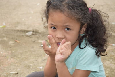 Portrait of cute girl holding camera