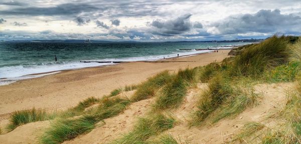 Scenic view of beach against sky