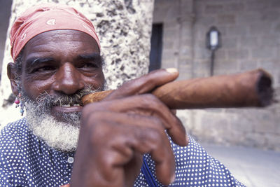 Close-up portrait of smiling man wearing mask